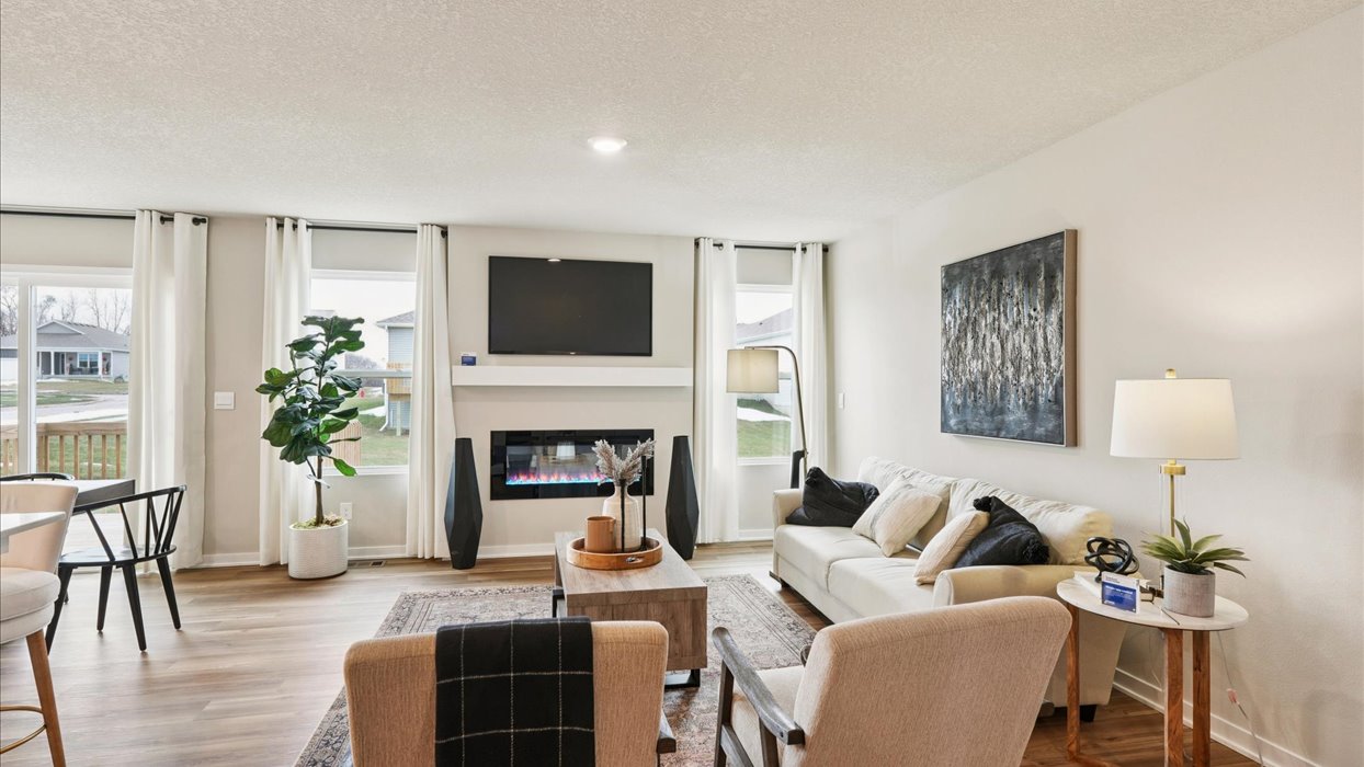 Open concept living room with electric fireplace