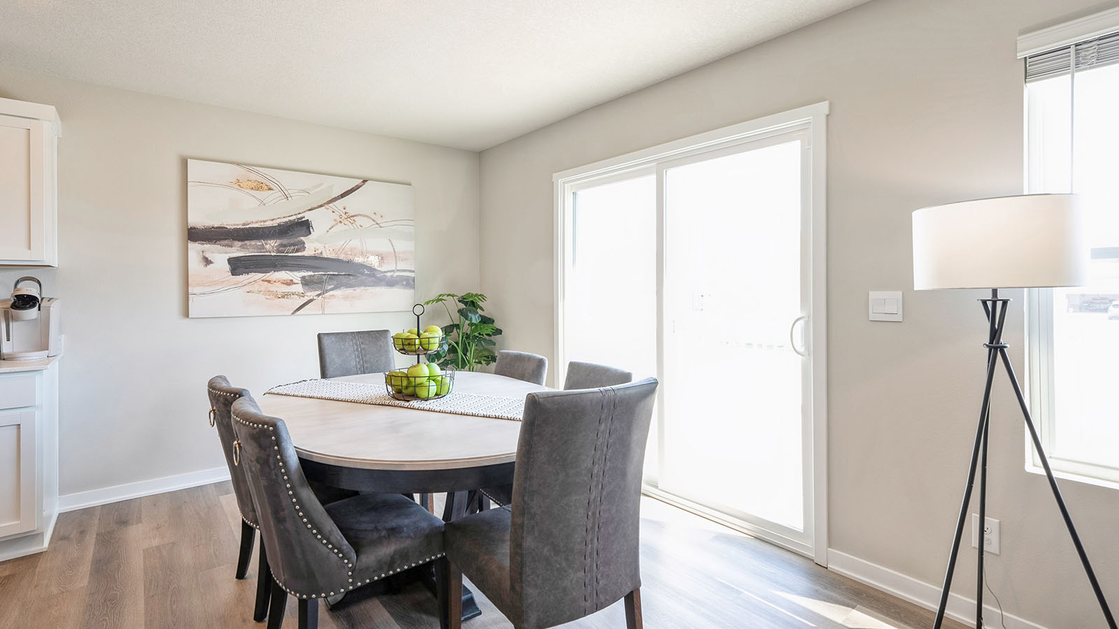 Open concept dining space with access to backyard