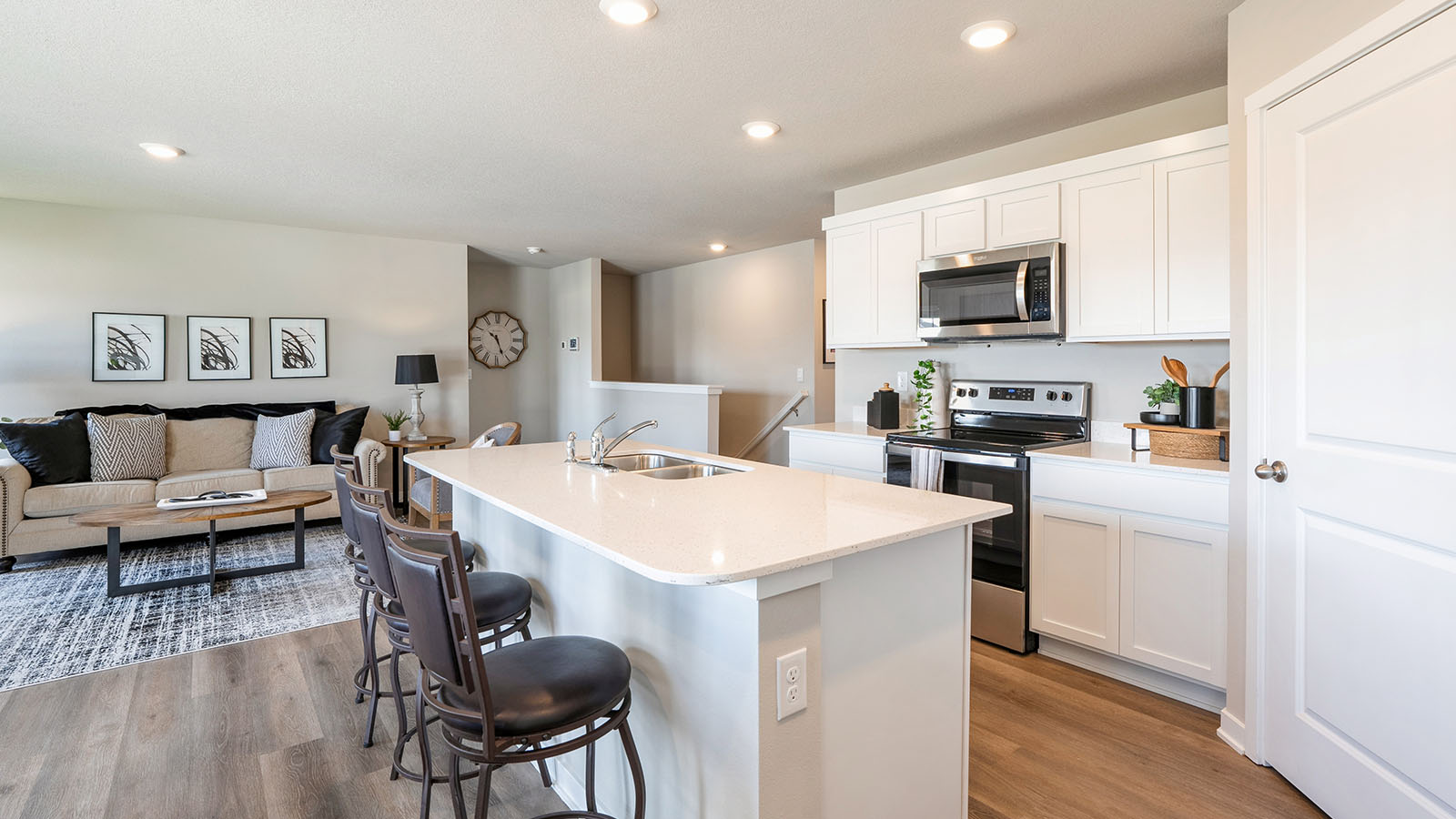Kitchen with white cabinetry and quartz countertop