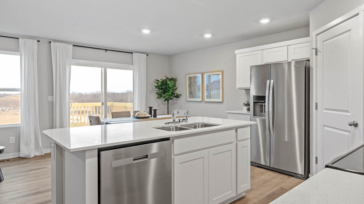 Kitchen with white cabinetry and quartz countertop