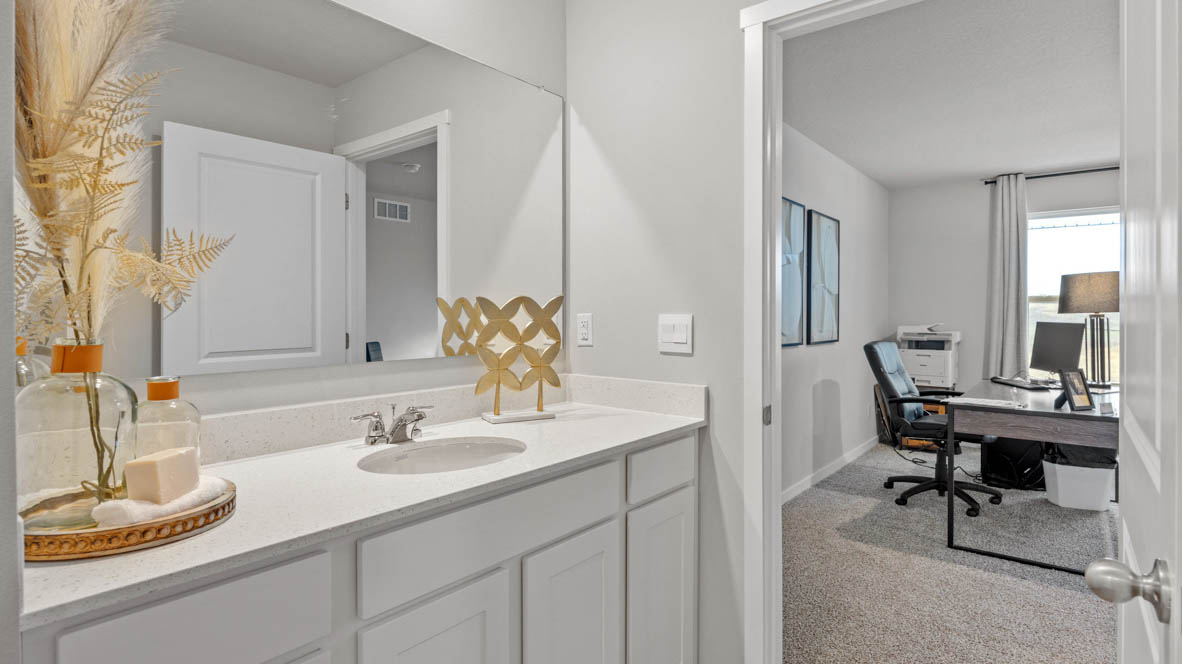 Stylish full bathroom with bright lighting and functional design.