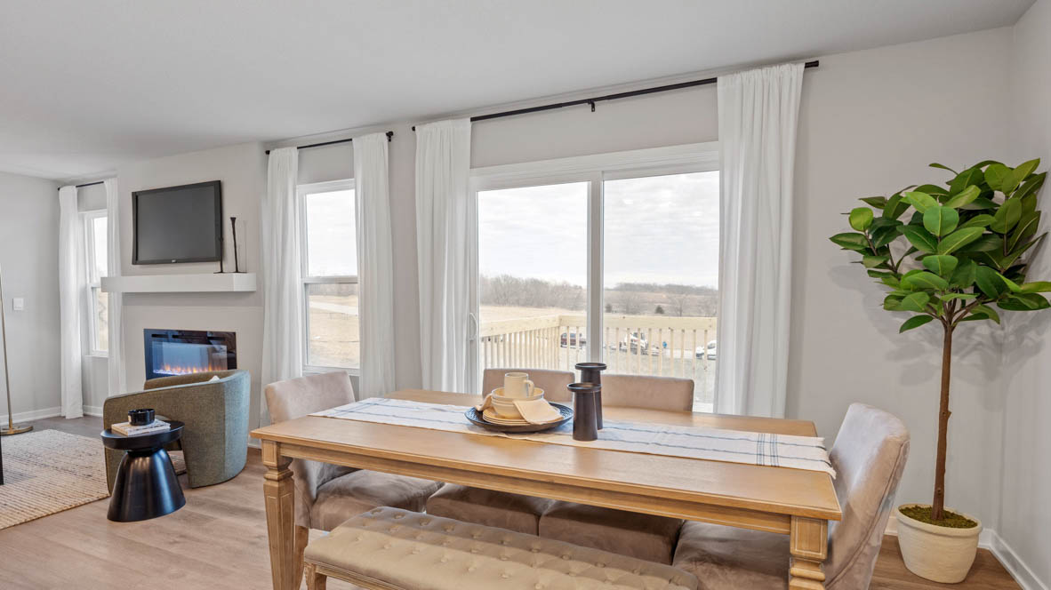 Open concept dining space with access to backyard