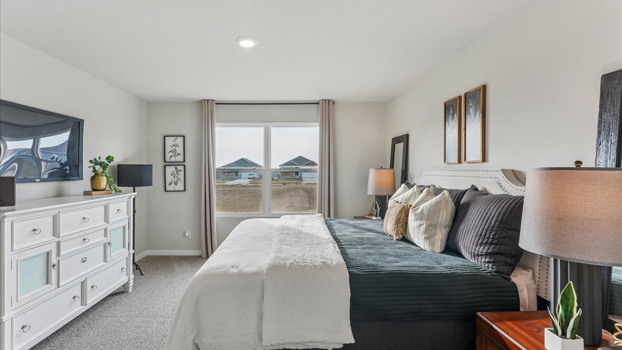 Primary bedroom with natural lighting and spacious layout