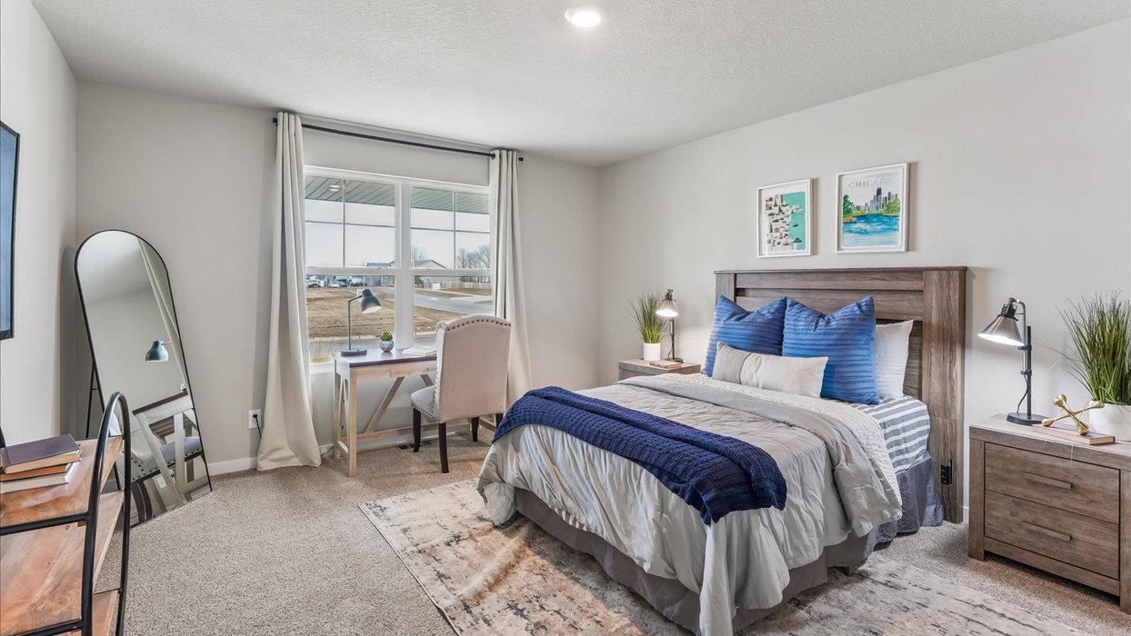 Comfortable secondary bedroom with natural light, modern finishes, and versatile living space.