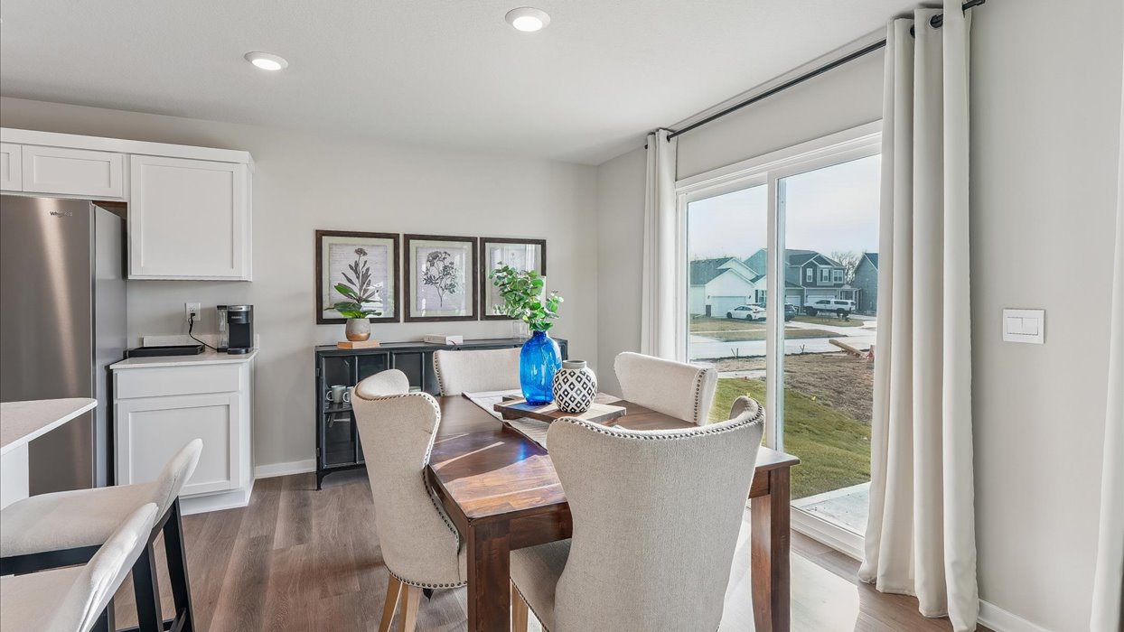 Open concept dining space with access to backyard