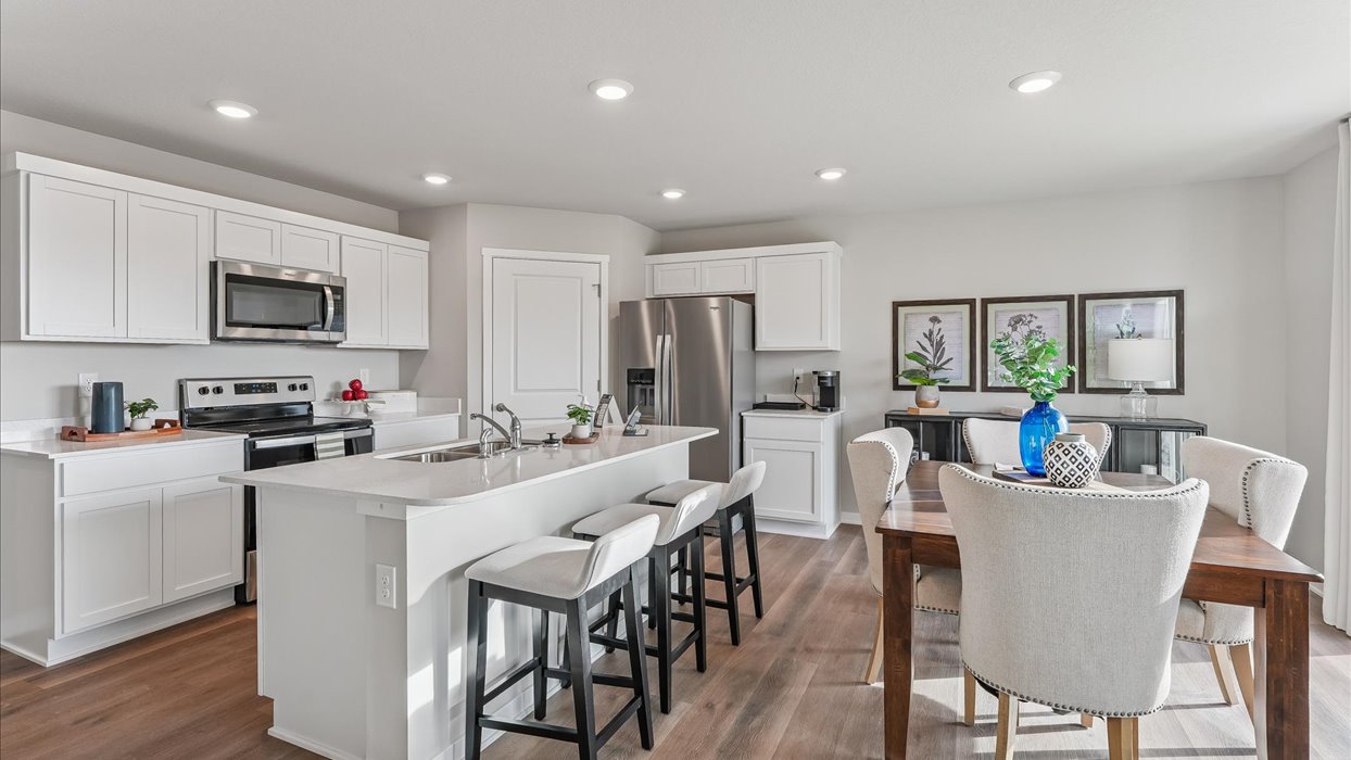 Kitchen with white cabinetry and quartz countertop