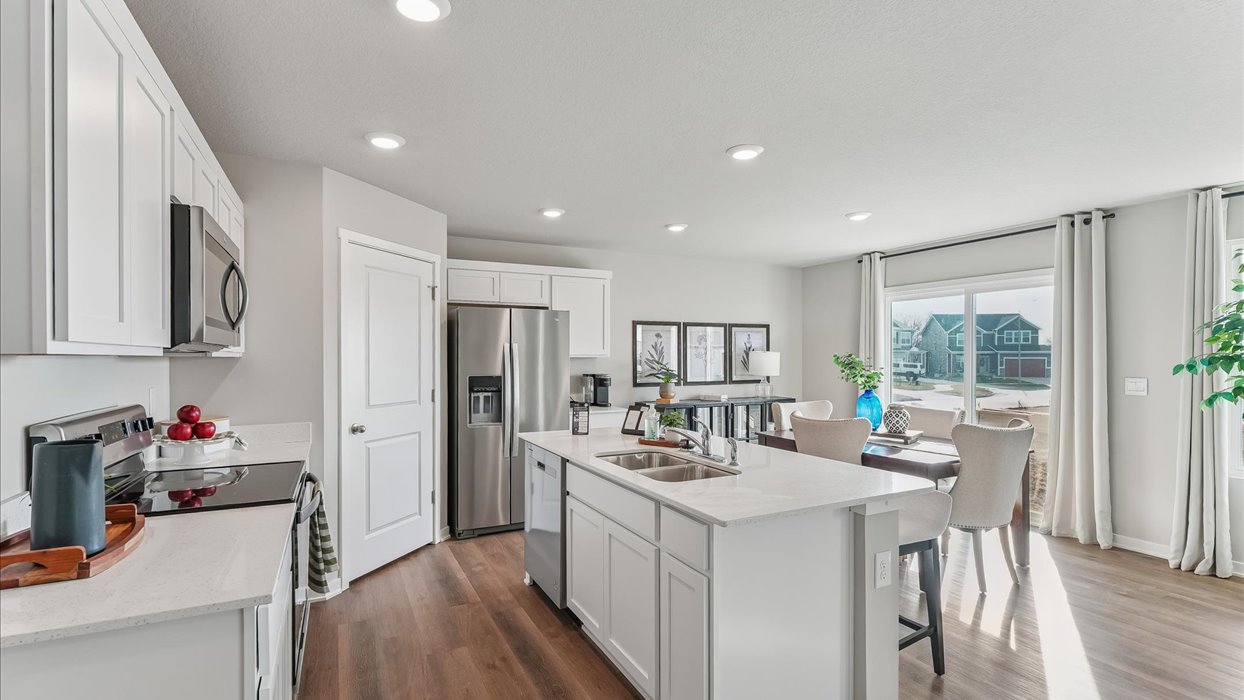 Kitchen with white cabinetry and quartz countertop