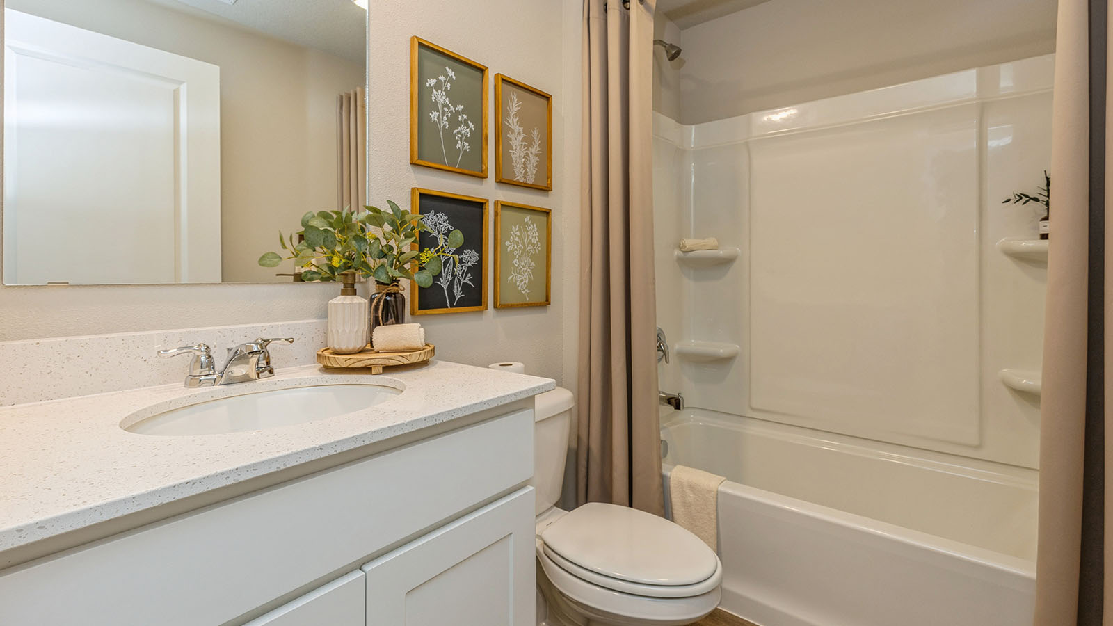 Bathroom with tub and shower combo, quartz countertops, and white vanity
