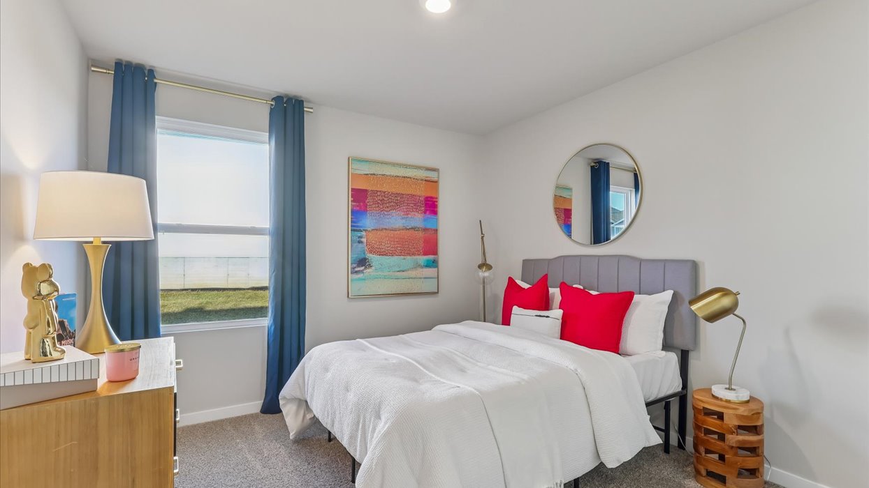 Comfortable secondary bedroom with natural light, modern finishes, and versatile living space.