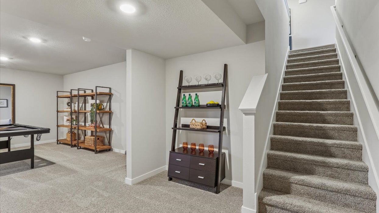 Finished basement living area with comfortable seating space and flexible room for entertaining or relaxing.