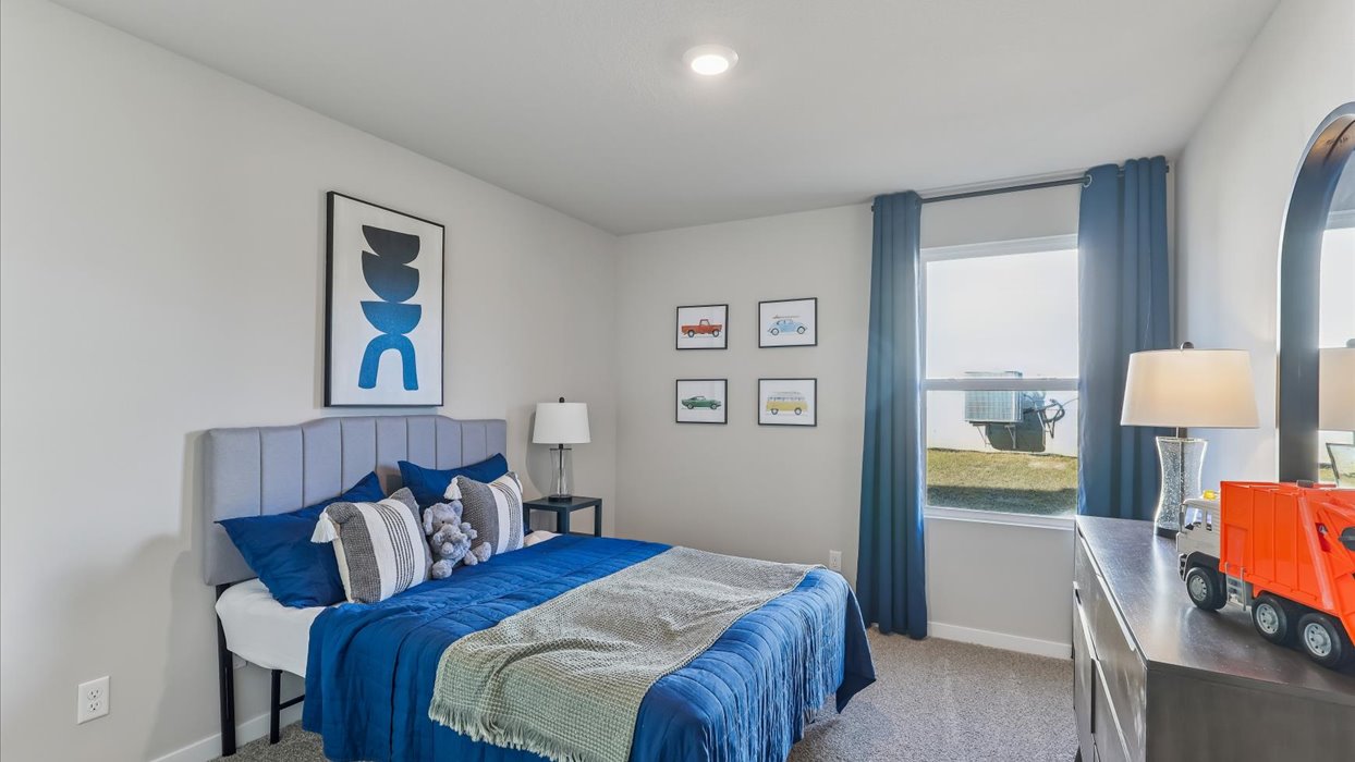 Comfortable secondary bedroom with natural light, modern finishes, and versatile living space.