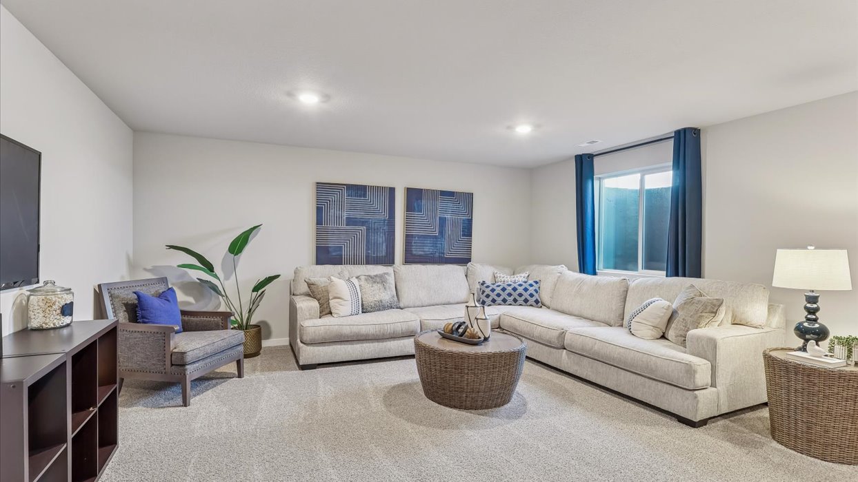Finished basement living area with comfortable seating space and flexible room for entertaining or relaxing.