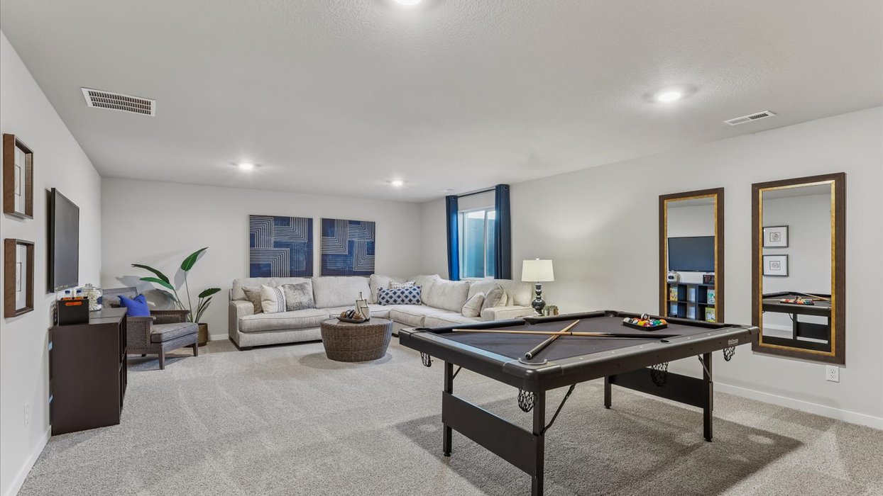Finished basement living area with comfortable seating space and flexible room for entertaining or relaxing.