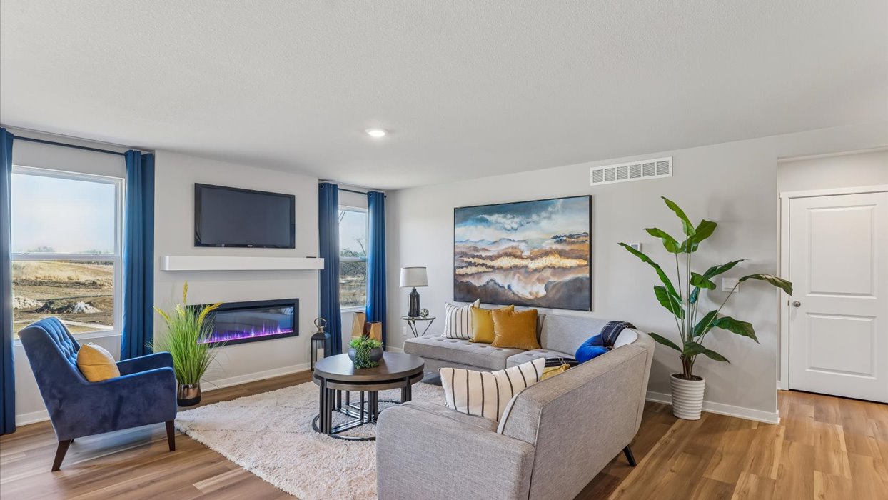 Open concept living room with electric fireplace