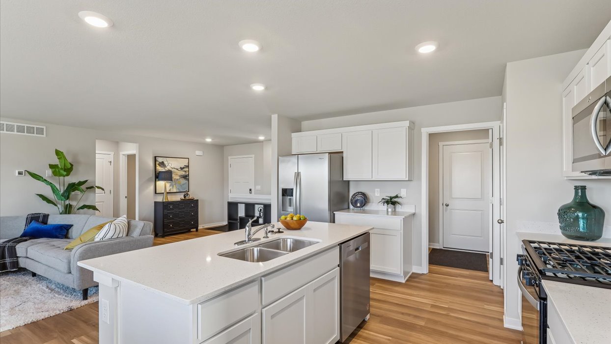Kitchen with white cabinetry and quartz countertop