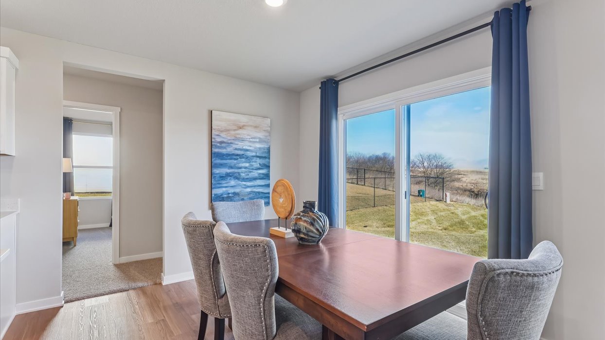 Open concept dining space with access to backyard