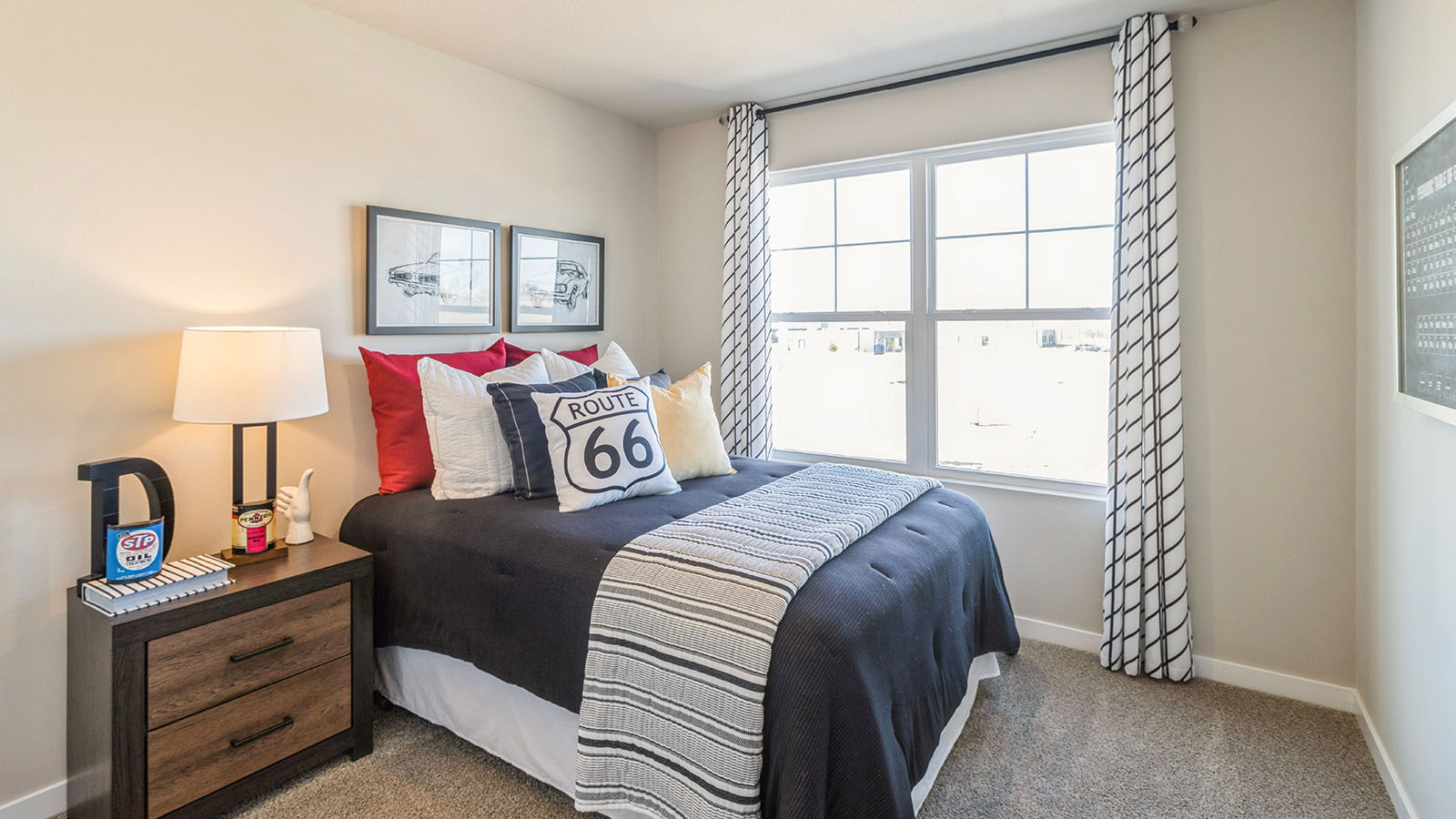third bedroom with grey bed and large window with nightstands