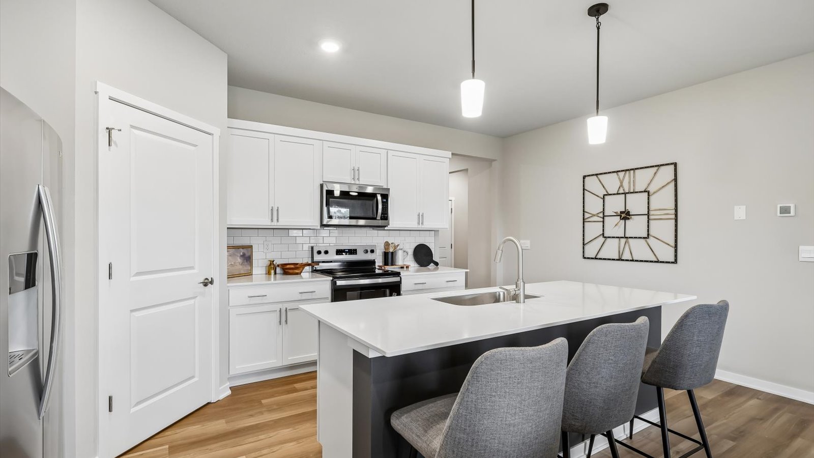 Kitchen with white cabinetry and quartz countertop