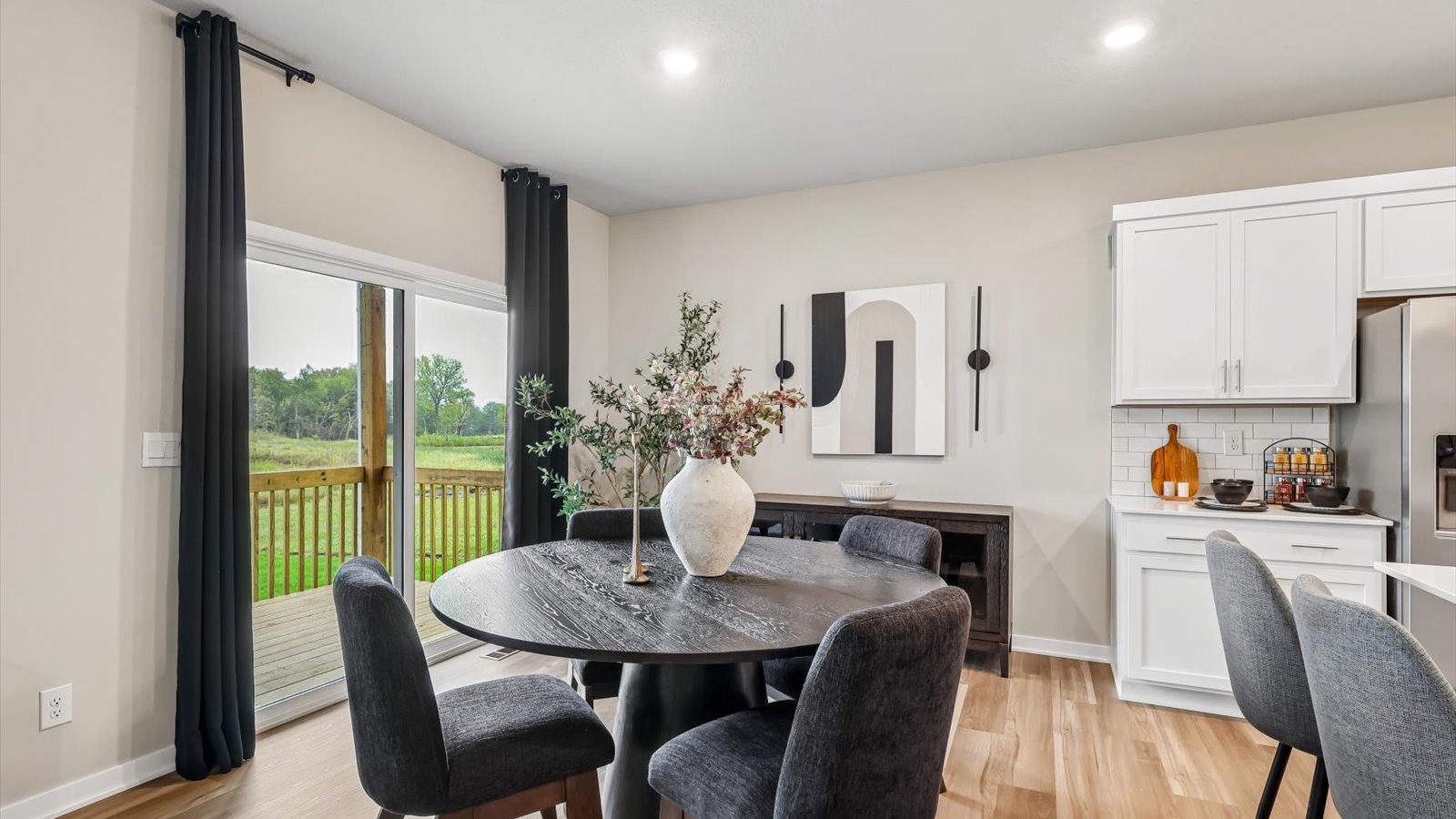 Open concept dining space with access to backyard