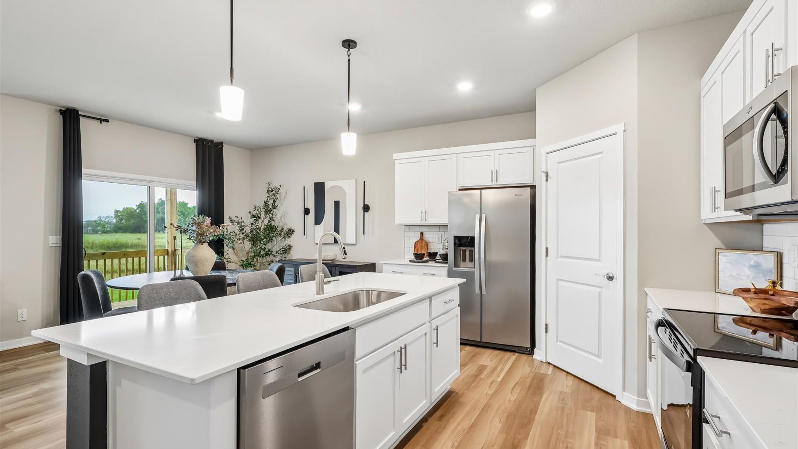 Kitchen with white cabinetry and quartz countertop