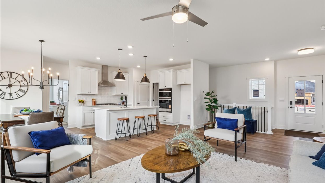 New home living room near front foyer with modern design details and functional connectivity for daily flexibility