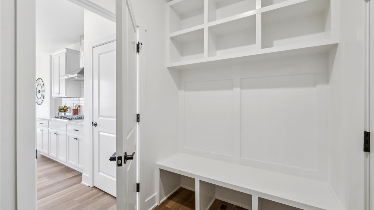 Off the garage, near the kitchen, the locker, mud room, snow room provides a perfect new home drop zone