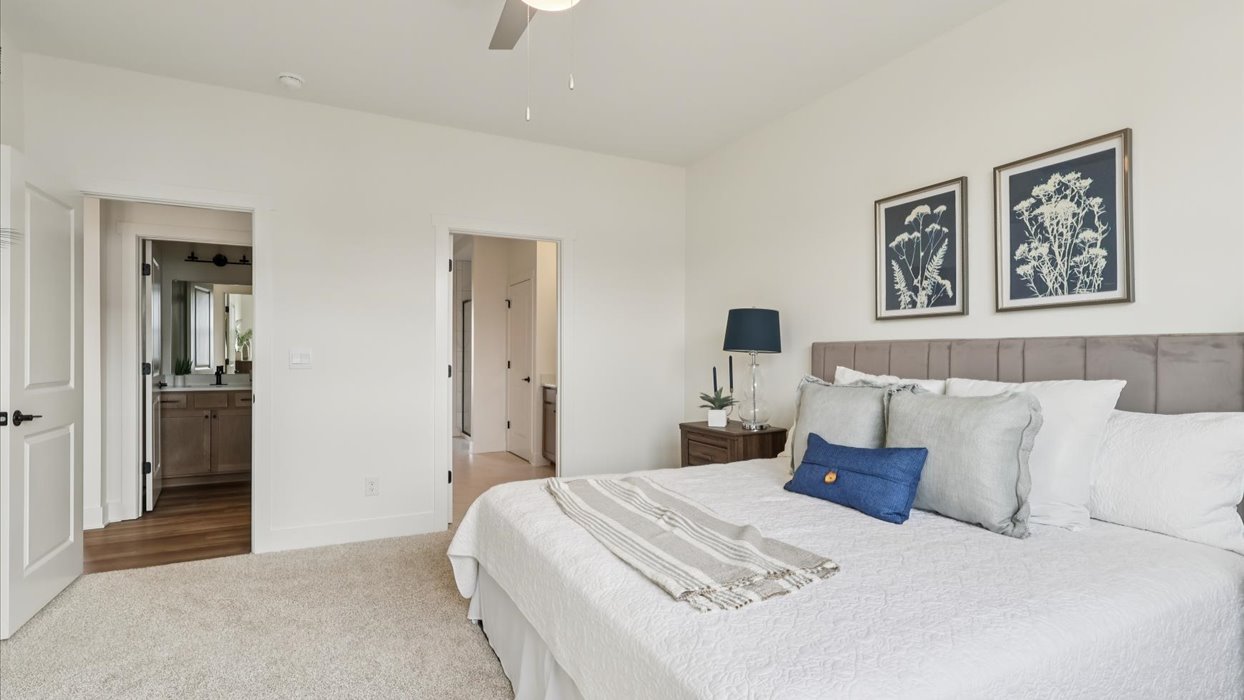 Primary bedroom designed with style and comfort in mind, flows to your spa-inspired ensuite and walk-in closet
