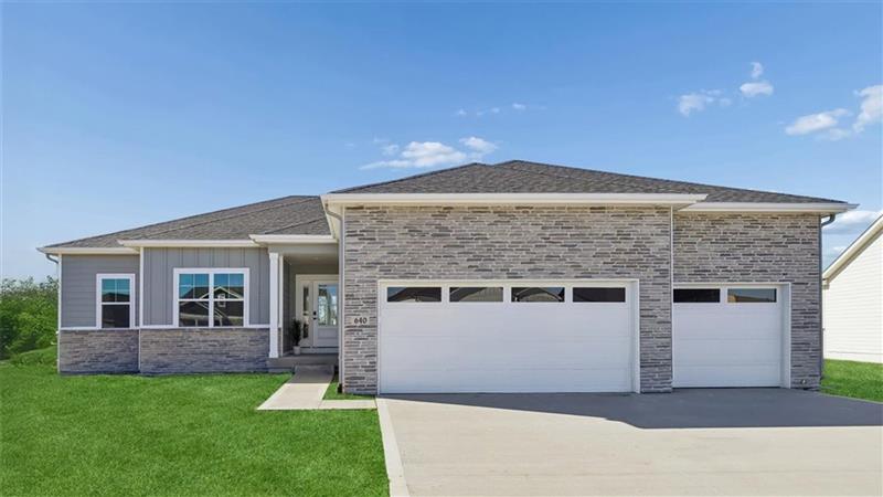 exterior of lincoln home with 3 car garage