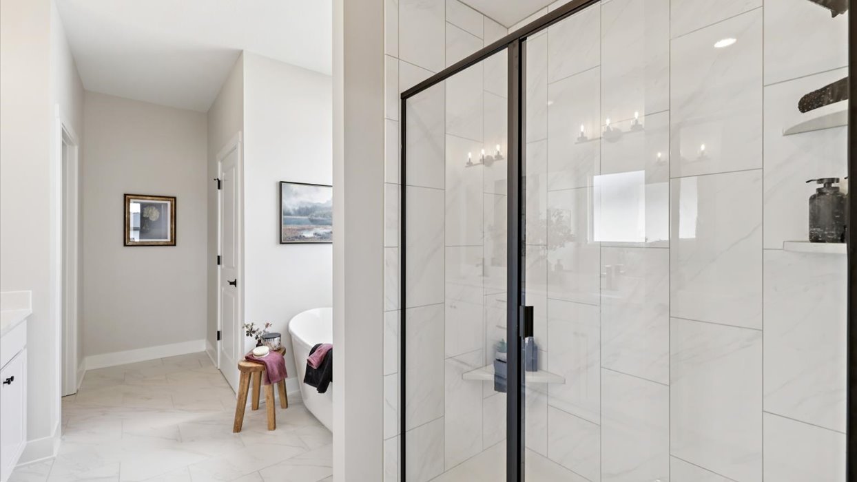 Owner’s en suite adds stylish appeal, spa-inspired design, adds walk-in shower, double vanity, walk-in closet access