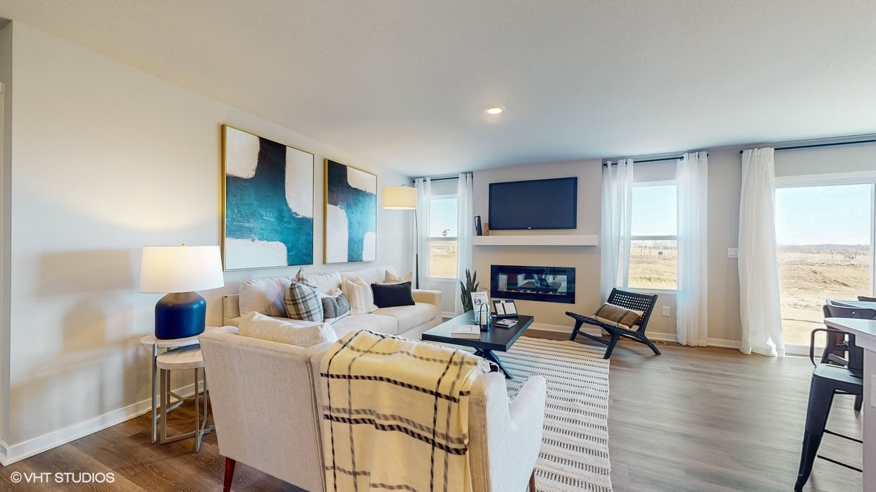 Open concept living room with electric fireplace