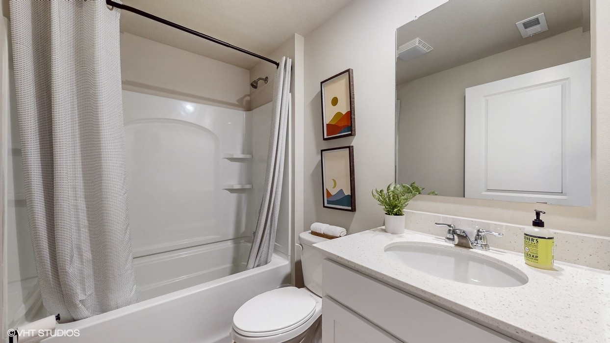 Stylish lower-level bathroom featuring contemporary fixtures and convenient access from the finished basement.
