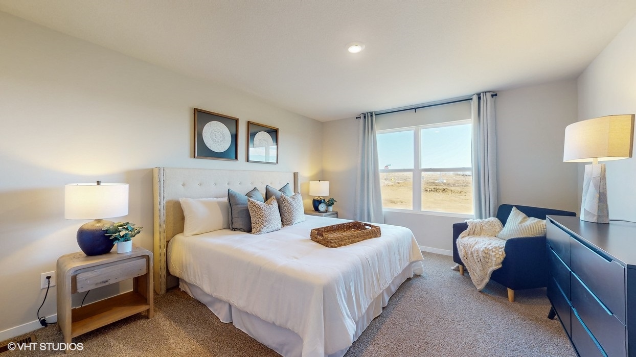 Primary bedroom with natural lighting and spacious layout