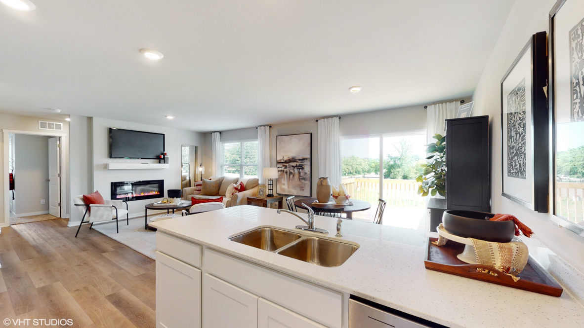 Kitchen with white cabinetry and quartz countertop