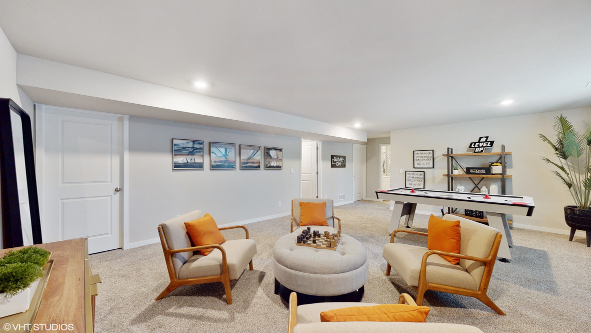 Finished basement living area with comfortable seating space and flexible room for entertaining or relaxing.