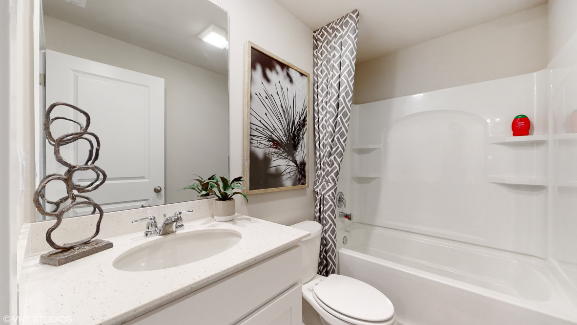 Stylish lower-level bathroom featuring contemporary fixtures and convenient access from the finished basement.