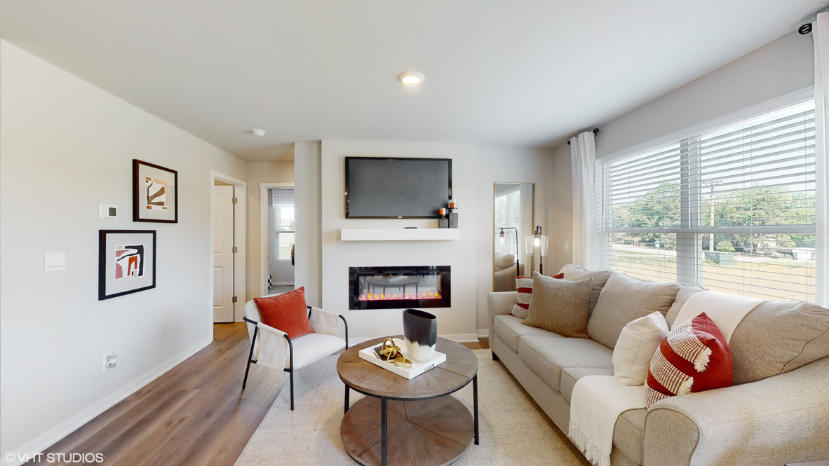 Open concept living room with electric fireplace