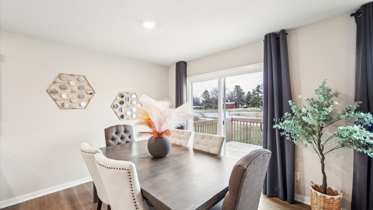 Open concept dining space with access to backyard