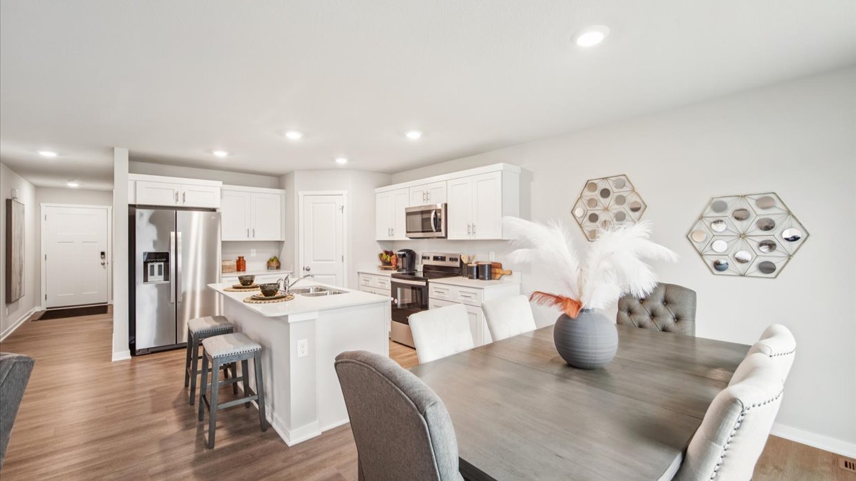 Open concept dining space with access to backyard