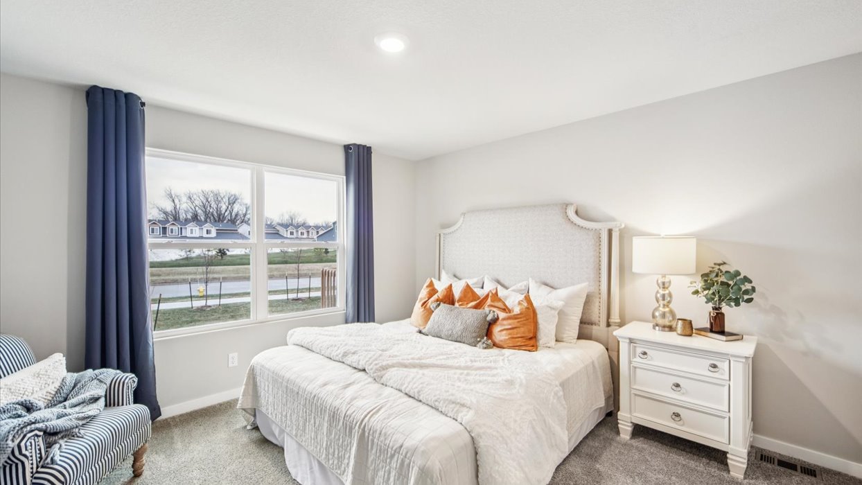 Primary bedroom with natural lighting and spacious layout