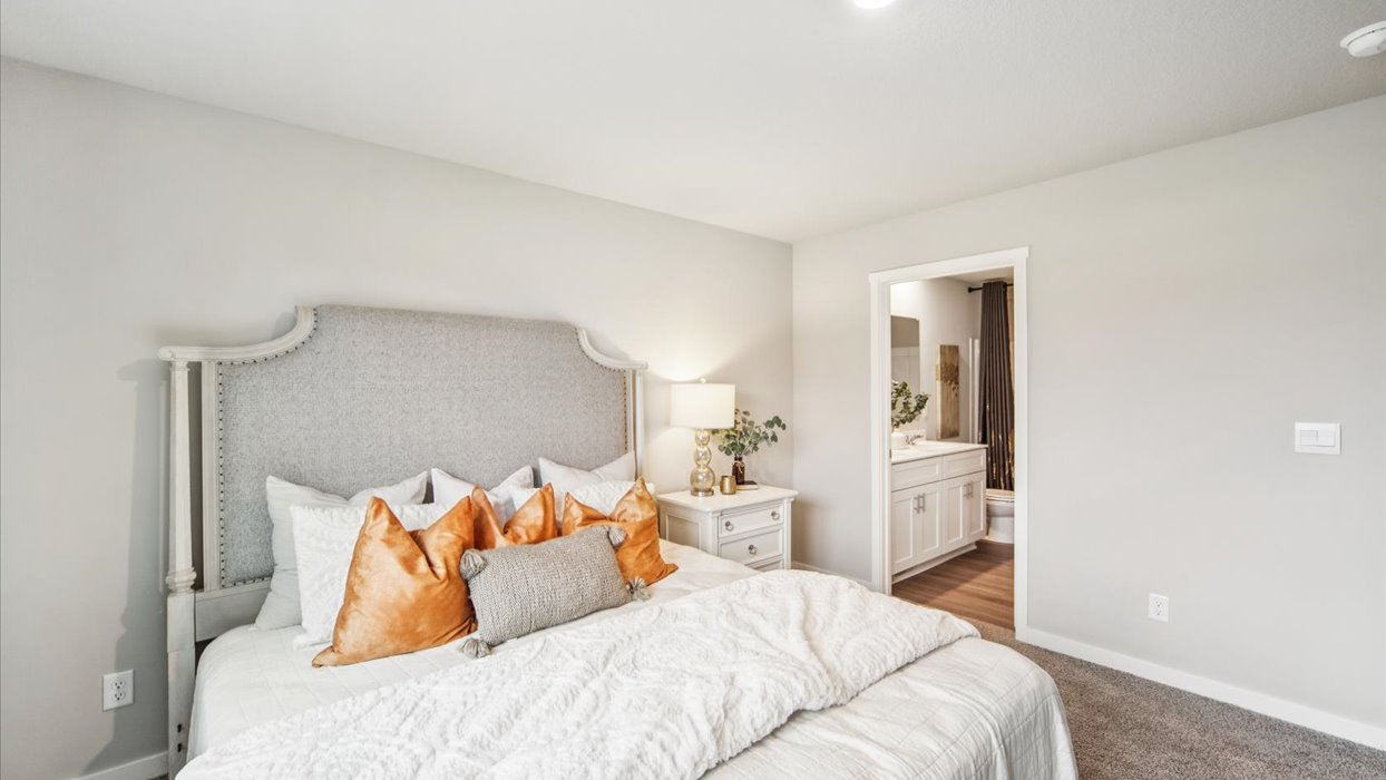 Primary bedroom with natural lighting and spacious layout