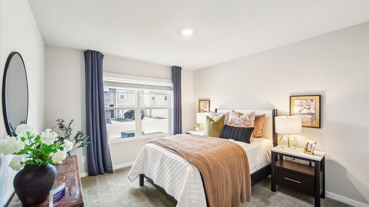 Comfortable secondary bedroom with natural light, modern finishes, and versatile living space.