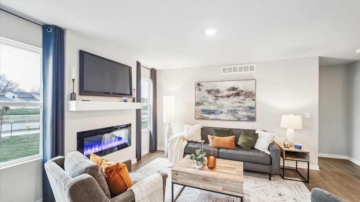 Open concept living room with electric fireplace