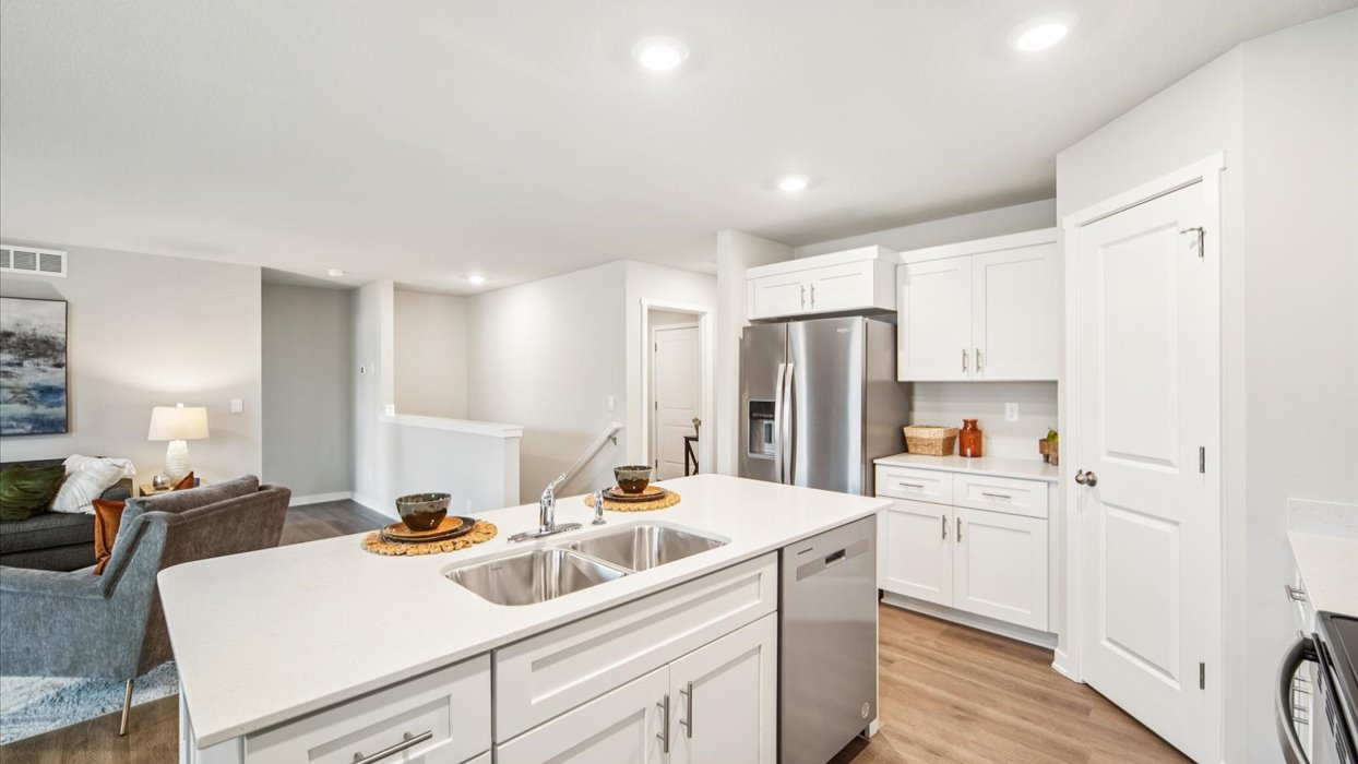 Kitchen with white cabinetry and quartz countertop