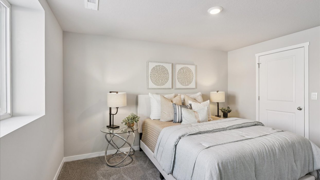 Comfortable secondary bedroom with natural light, modern finishes, and versatile living space.