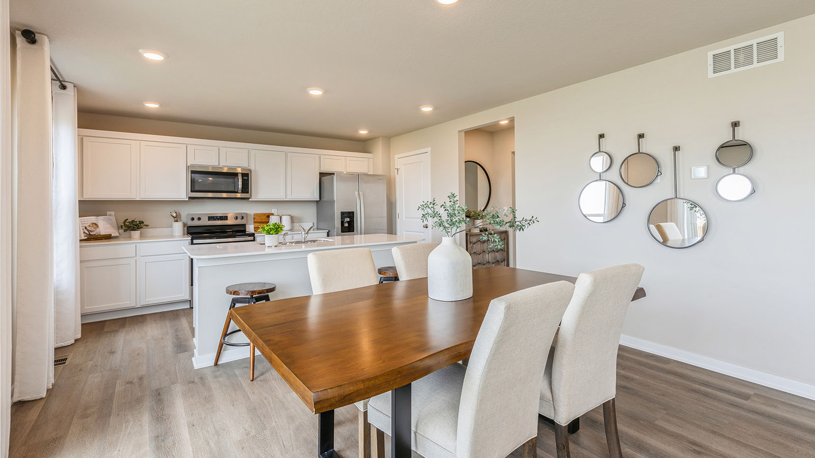 Open concept dining space with access to backyard