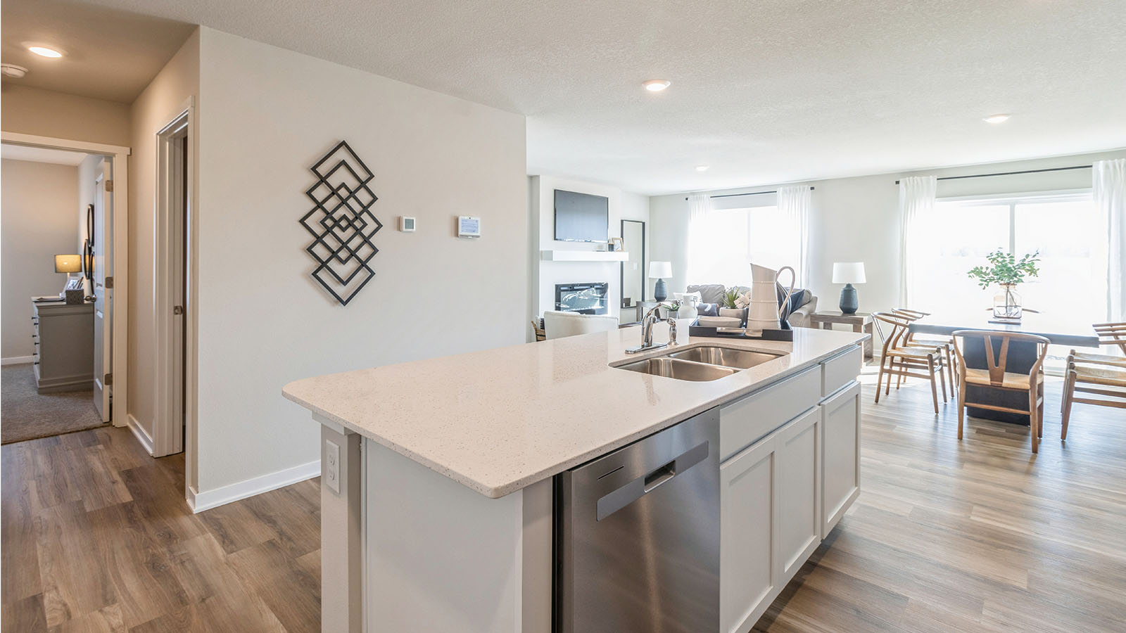 Kitchen with white cabinetry and quartz countertop