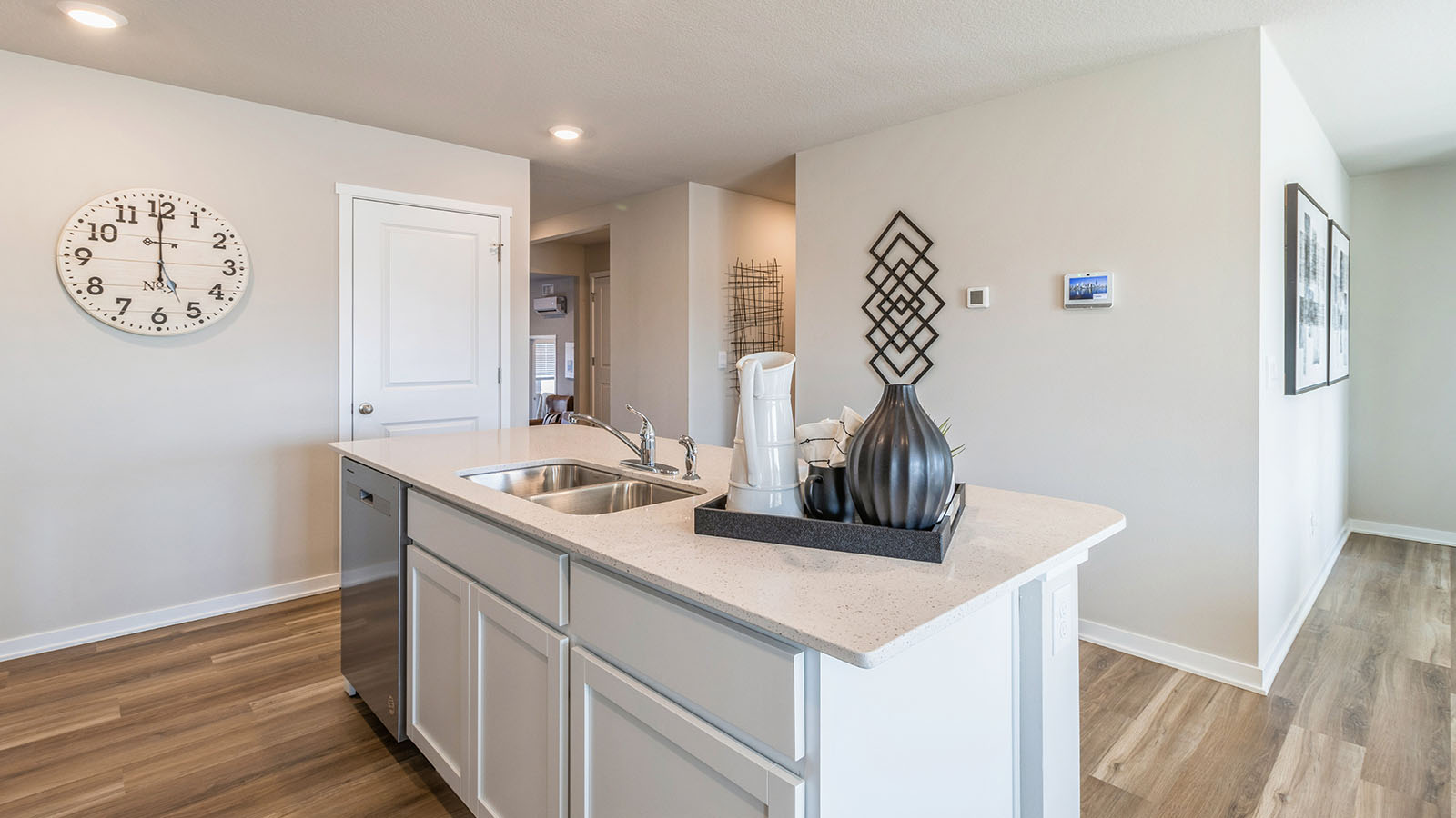 Kitchen with white cabinetry and quartz countertop