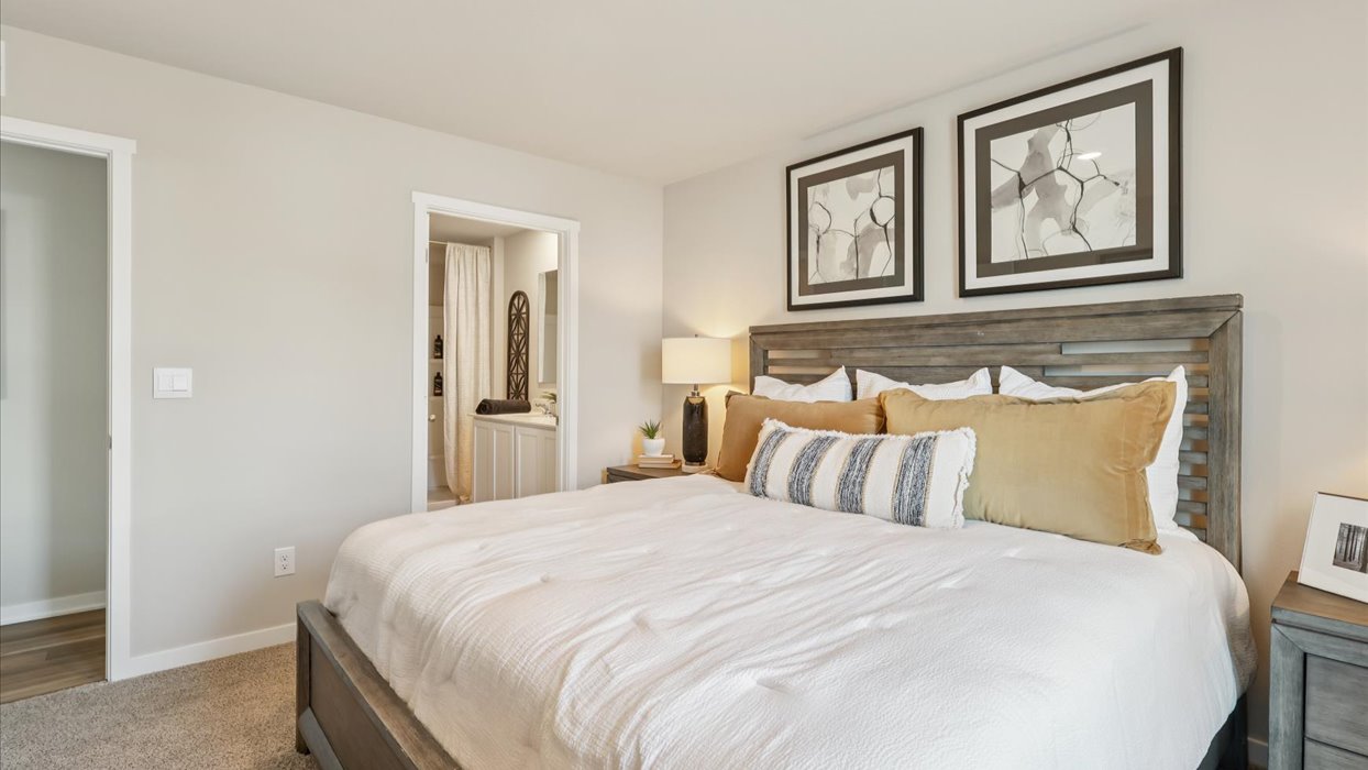 Primary bedroom with natural lighting and spacious layout