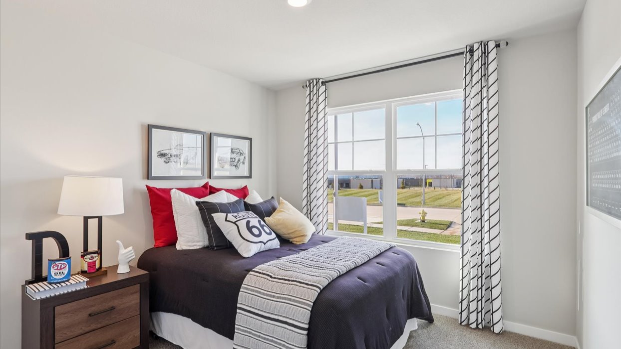 Comfortable secondary bedroom with natural light, modern finishes, and versatile living space.