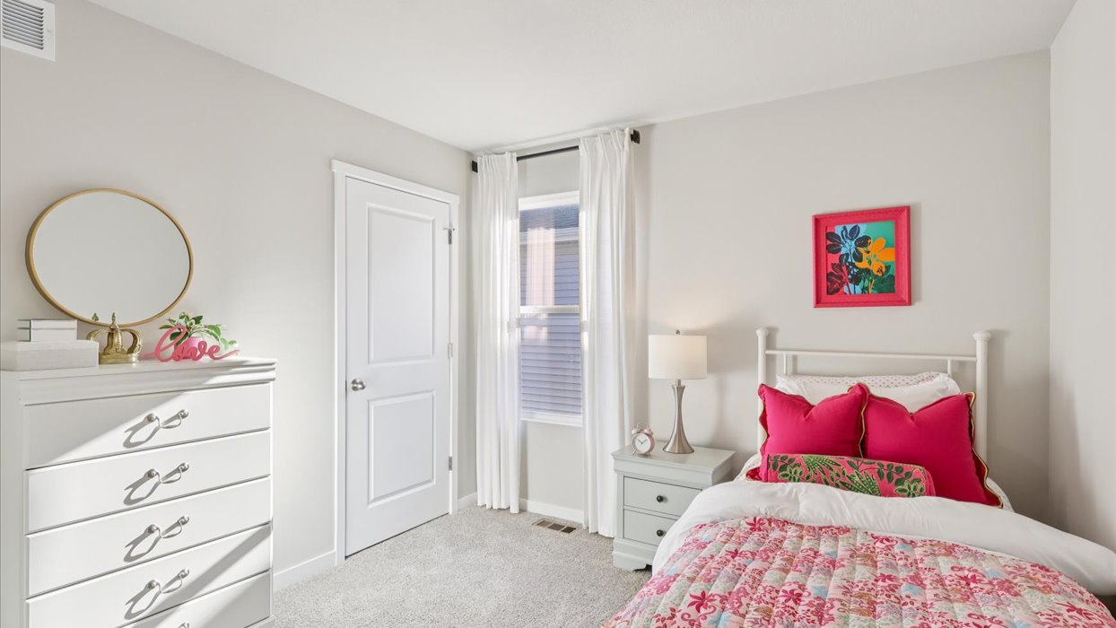 Comfortable secondary bedroom with natural light, modern finishes, and versatile living space.